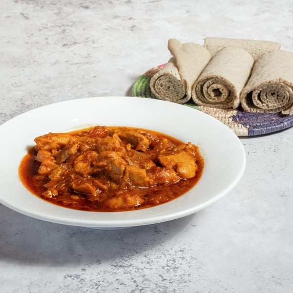 Walia Ethiopian Cuisine's Doro Wat, a chicken stew, served with rolled injera bread.
