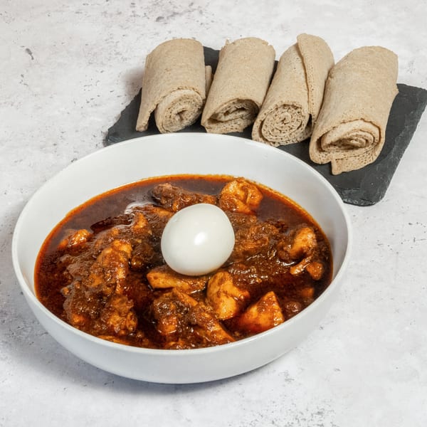 Walia Ethiopian Cuisine's Doro Wat, a chicken stew with a hard-boiled egg, served with injera bread.